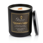 A black glass jar candle with a matching black lid leaning against it on a white background. The front label reads Grace Street Candle and Crenshaw & Vernon, with white wax visible at the top and a small wooden wick.