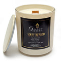Grace Street Due Season scented candle in a cream-colored glass jar with a black and gold label, shown with its lid leaning against the jar on a white background.