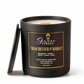 Grace Street Candle in a matte black jar with a black lid leaning against it, featuring a black label with gold lettering that reads 'Manchester & Market' on a white background.