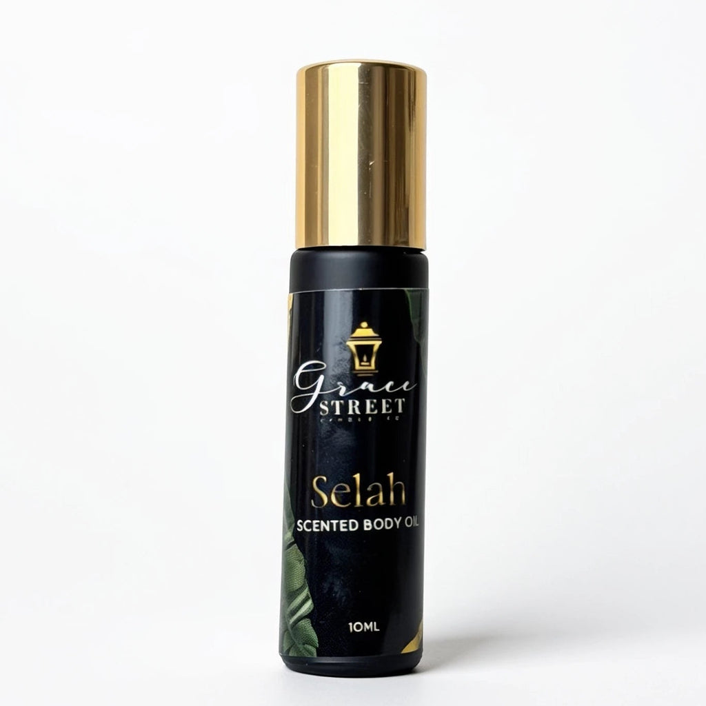 A 10ml bottle of Grace Street Selah Scented Body Oil on a clean white background. The bottle is black with a shiny gold cap and features the Grace Street brand logo and the product name 'Selah' in gold lettering.