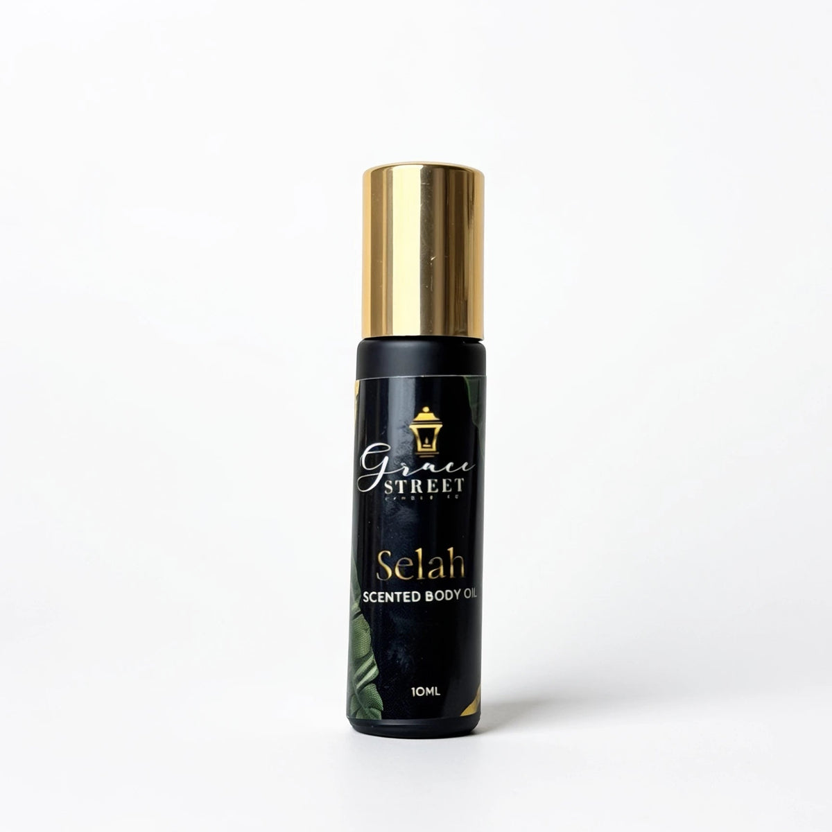 A 10ml bottle of Grace Street Selah Scented Body Oil on a clean white background. The bottle is black with a shiny gold cap and features the Grace Street brand logo and the product name 'Selah' in gold lettering.